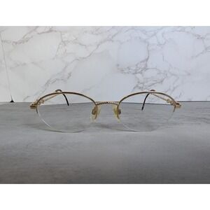 Yves Saint Laurent Gold Rimless Oval Glasses